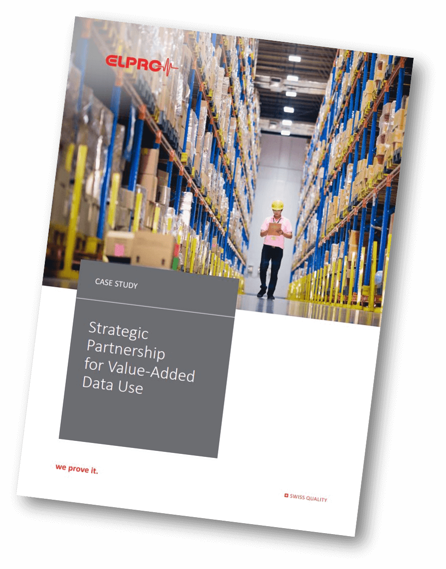 Warehouse manager walks through the warehouse with tablet in hand.