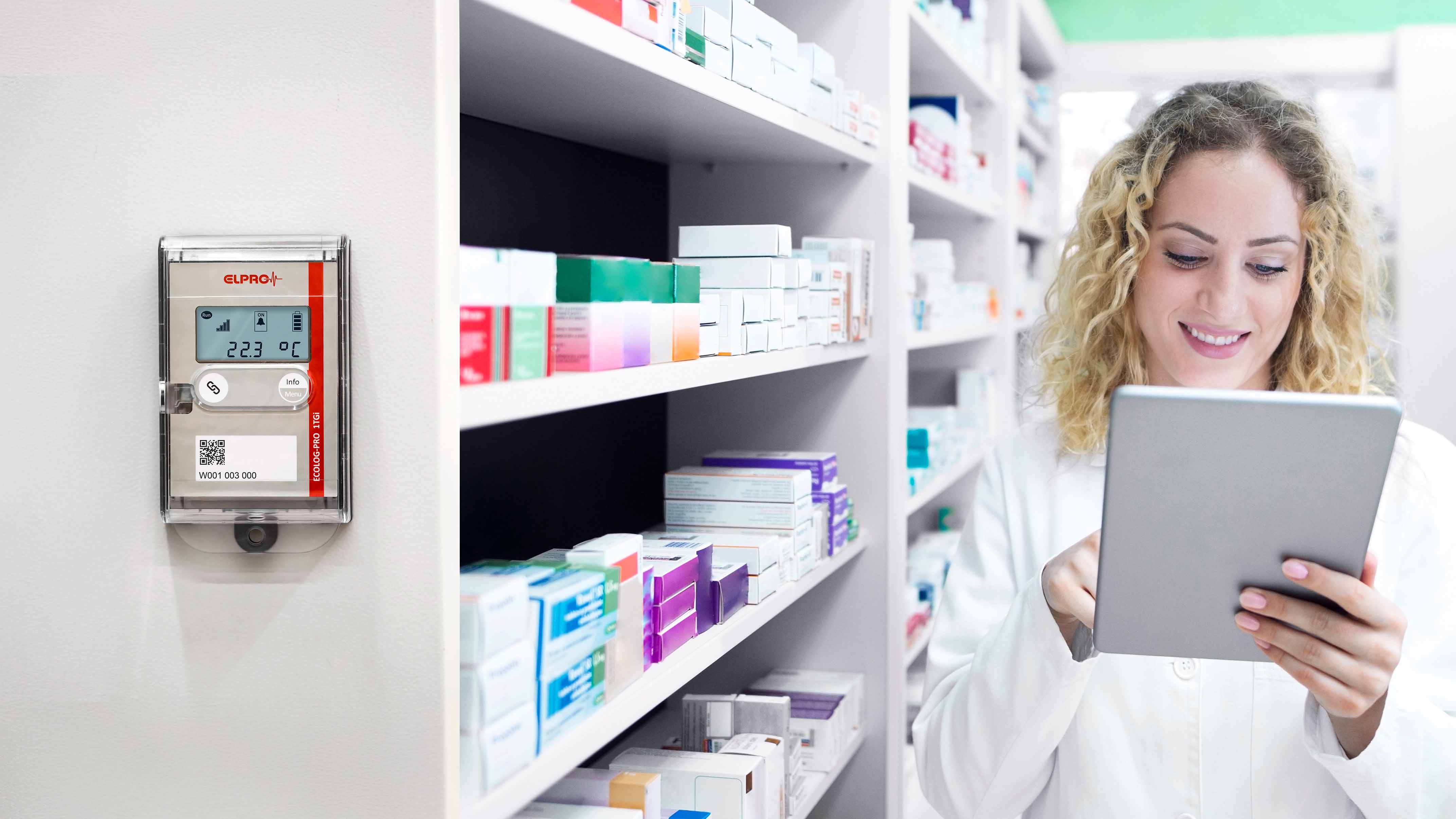 Pharmacist checks the stock of medication on a tablet.