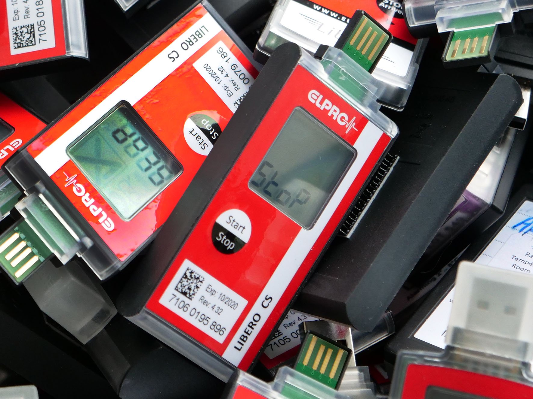 Devices lie on top of each other in a box.