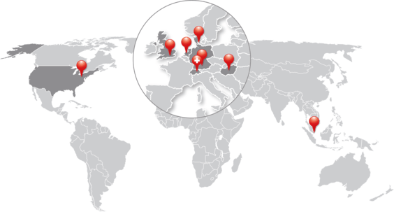 Red markers that show the company's locations on a gray world map.