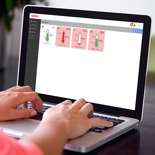 Laptop screen on which temperature displays are shown in green and red.