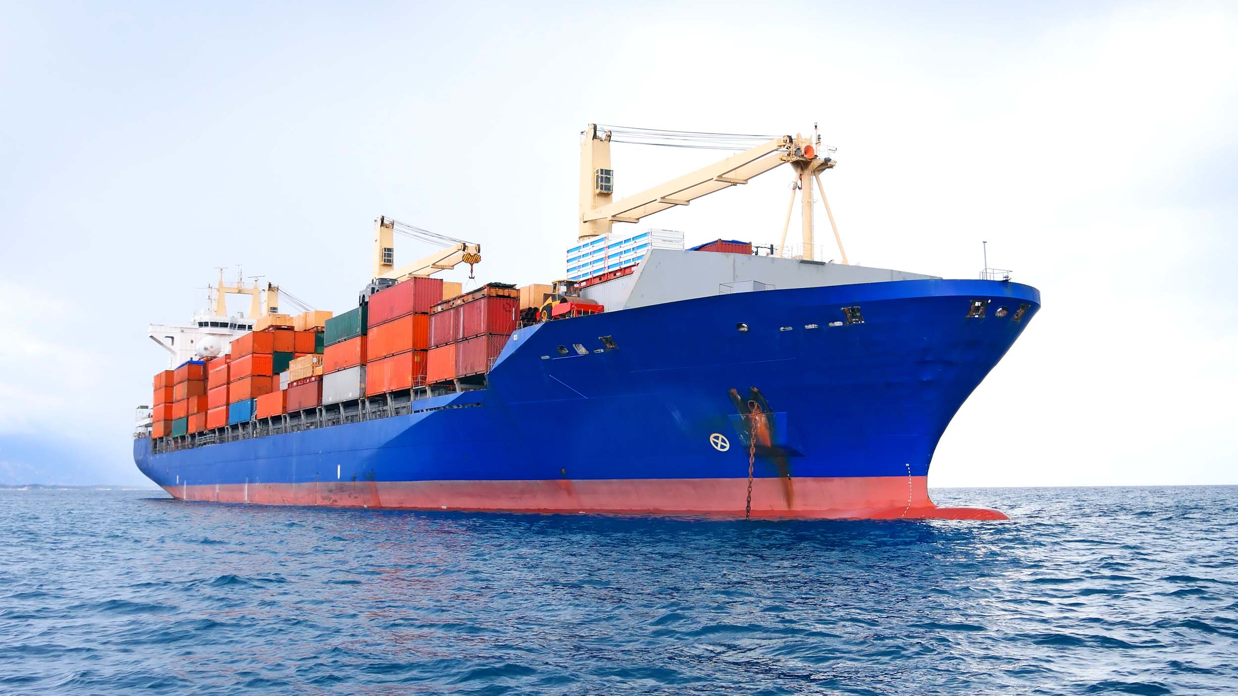 Large container cargo ship transporting shipping containers